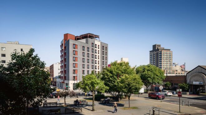 Apartment building with trees nearby