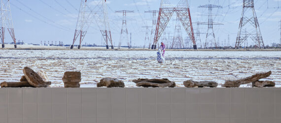 A table with an assortment rocks set with a background of powerlines