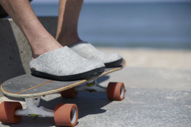 A pair of slip-ons on top of a skateboard
