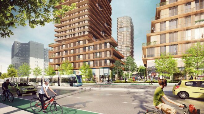A gathering space between high-rise buildings where people are walking and biking