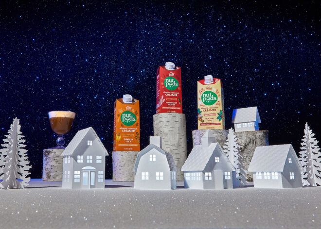 Three non-dairy creamers amidst a paper town village
