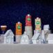 Three non-dairy creamers amidst a paper town village