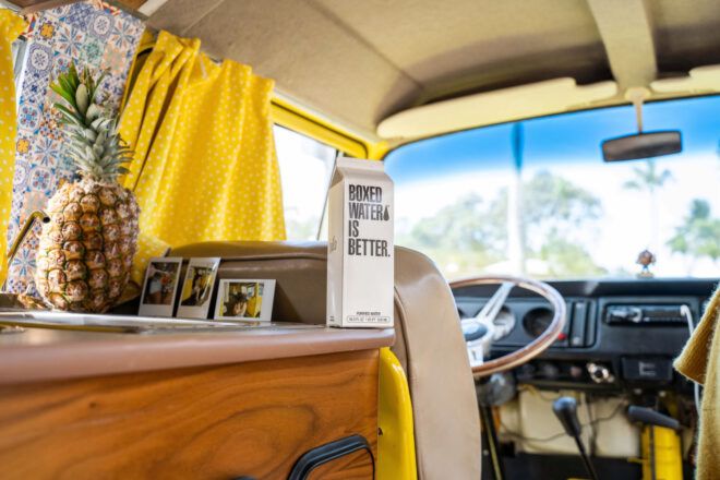Inside a renovated van with Boxed Water on counter