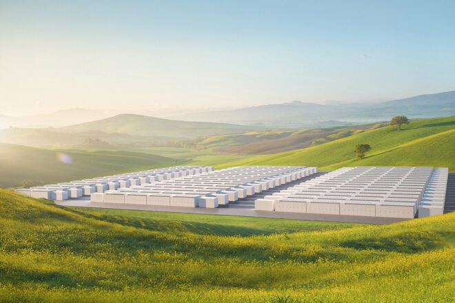 Rows and rows of EV charging ports in a green pasture valley area