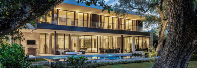 Outdoor view of the waterfront house by Strang Design