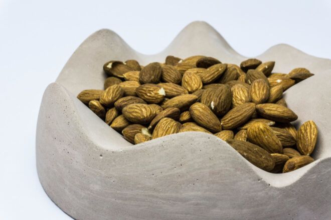 Almonds in a bowl with a wavy edge