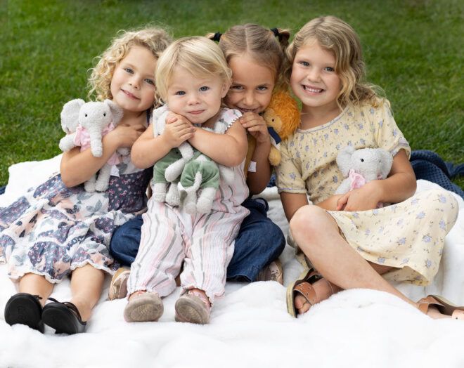 children holding stuffed elephant animals