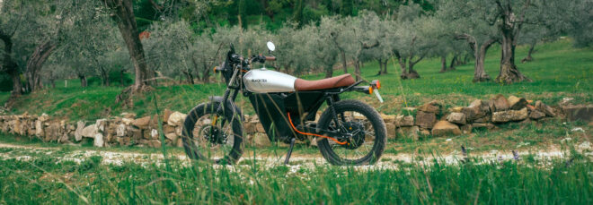 Motorbike on a path surrounded by trees and greenery