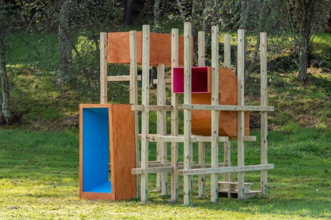 Square, colorful wooden boxes and trellises