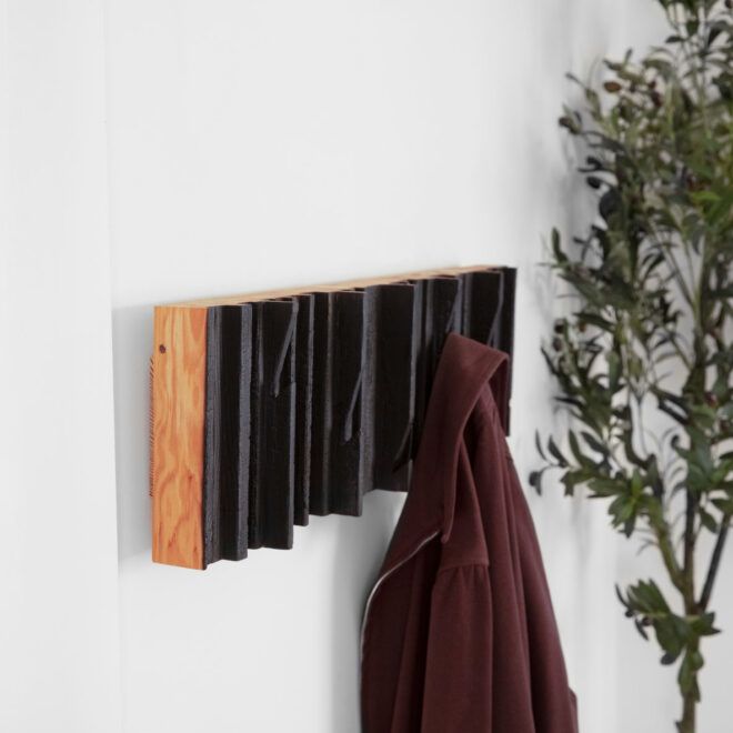 Coat hanger shelf made from construction waste