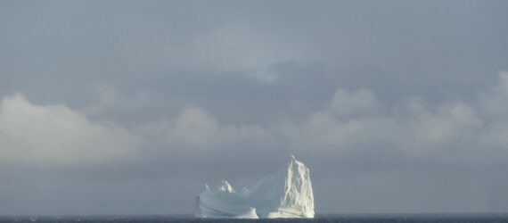 A horizon with a glacier island in the distance