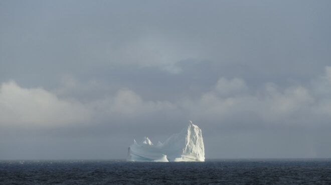 A horizon with a glacier island in the distance