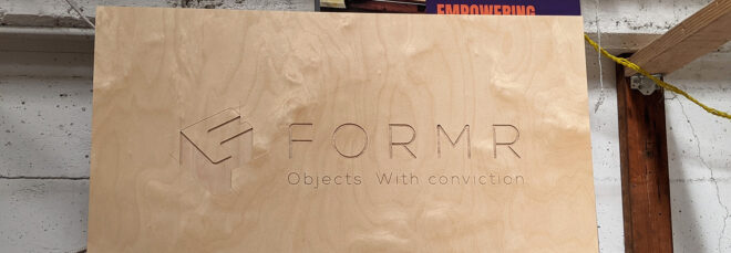 Wooden sign that says "Formr" and "objects with conviction"
