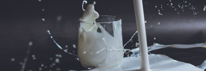 Milk splashing from a cup