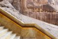 Rock stairs leading down steep rock mountain