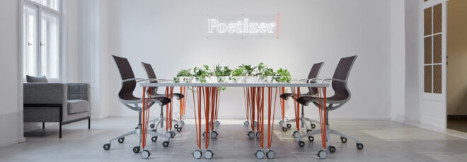 Meeting room with "Poetizer" as a white LED sign