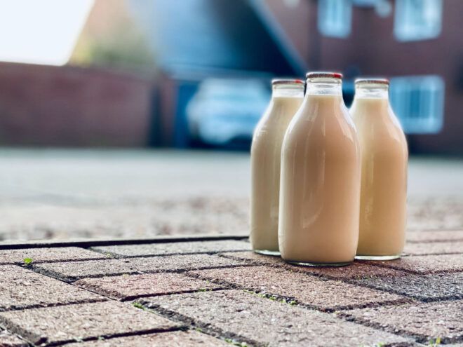 Glass milk cartons on the sidewalk