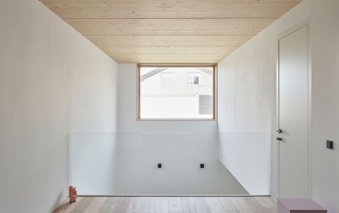 Timber ceiling on upper level hallway and large window