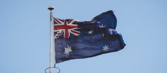 An Australian flag on a flag pole