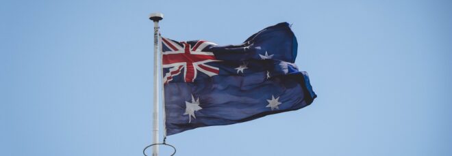 An Australian flag on a flag pole