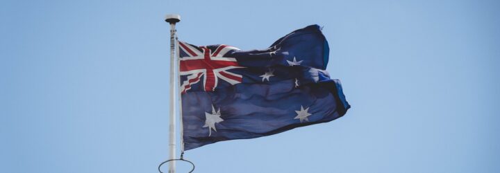 An Australian flag on a flag pole