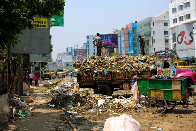 A waste disposal in the middle of a city landscape