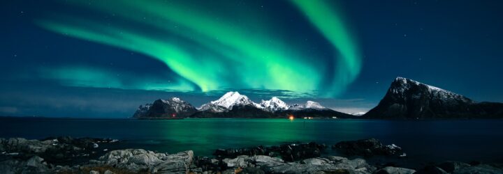 Northern lights across an arctic landscape