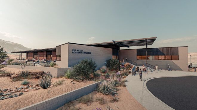 A low school building in a desert landscape