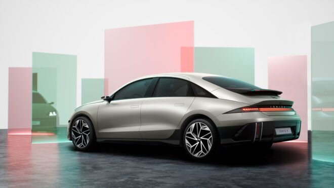 A silver sleek Hyundai car parked in a room with square panels
