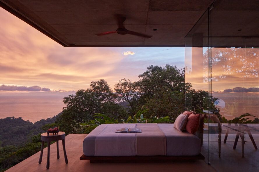 Terrace with a bed at sunset