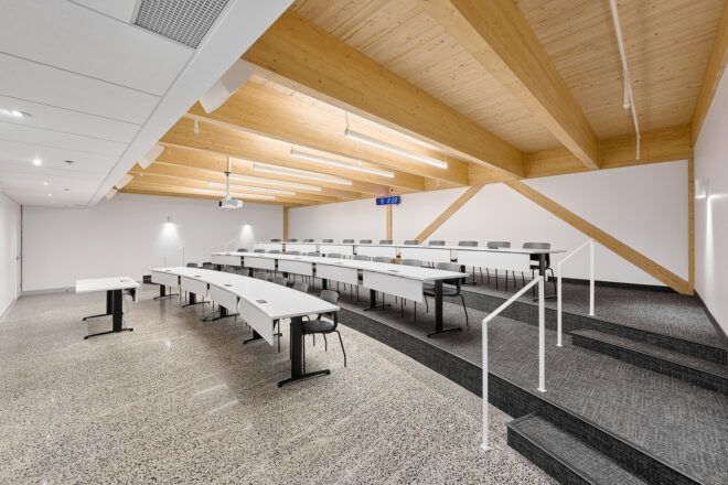 A study room with desks in different layers with a stair for each level