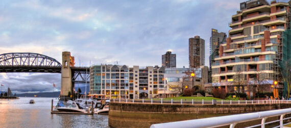 Vancouver waterfront with housing developments and a bridge in the background