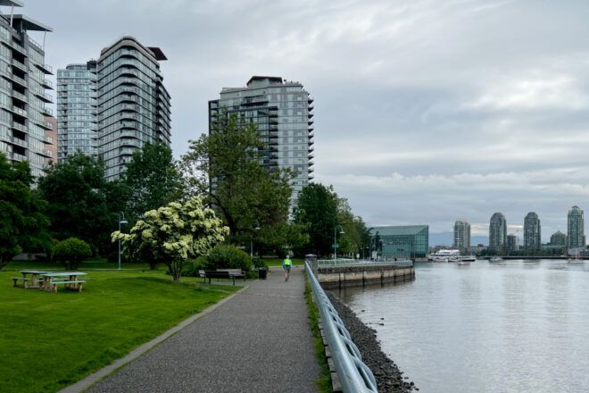 Park along Vancouver waterfront with high rise buildings in the background