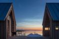 A cabin opened up in the middle toward a sunset