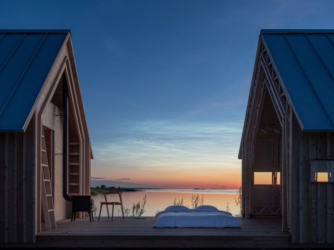 A cabin opened up in the middle toward a sunset