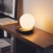 A glowing orb set on a desk