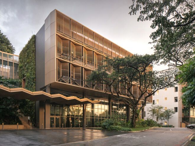 A university building with a upper floor jutting outward