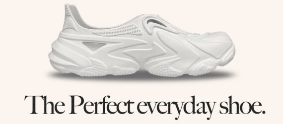 A white shoe with black text below that reads 