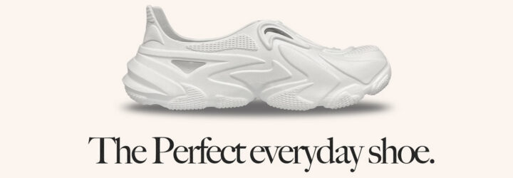 A white shoe with black text below that reads 