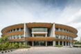 A curved structure full of windows
