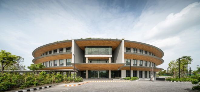 A curved structure full of windows