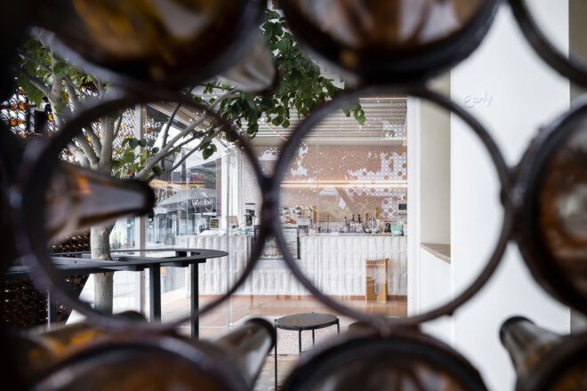 Circular bottle holder cutouts into a cafe shop