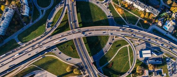 An aerial view of a highway intersecting with highways underneath