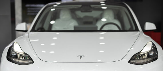 The front of a white Tesla vehicle
