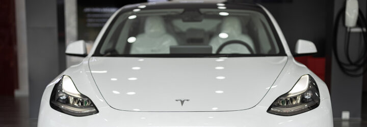 The front of a white Tesla vehicle