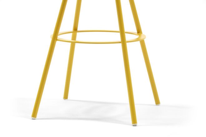The four feet of a yellow stool