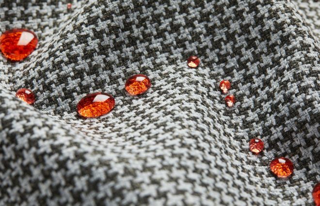 A houndstooth pattern cloth with beads of red liquid