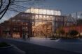 A school lit up in the evening with a glass exterior