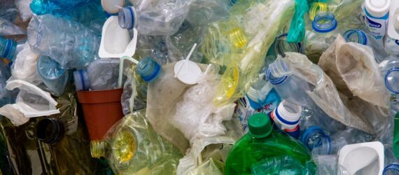 A bunch of different plastic products crushed and squished together