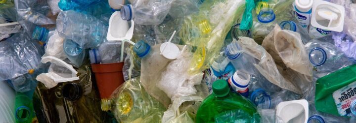 A bunch of different plastic products crushed and squished together